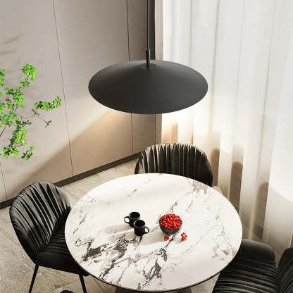 Modern black pendant light over dining table with marble table