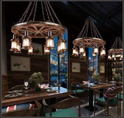 Dining room with Austin wood & metal wheel pendant lighting.