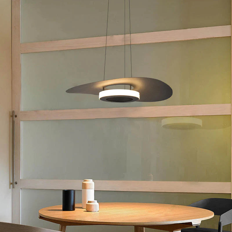 Modern Carins LED pendant light over dining table