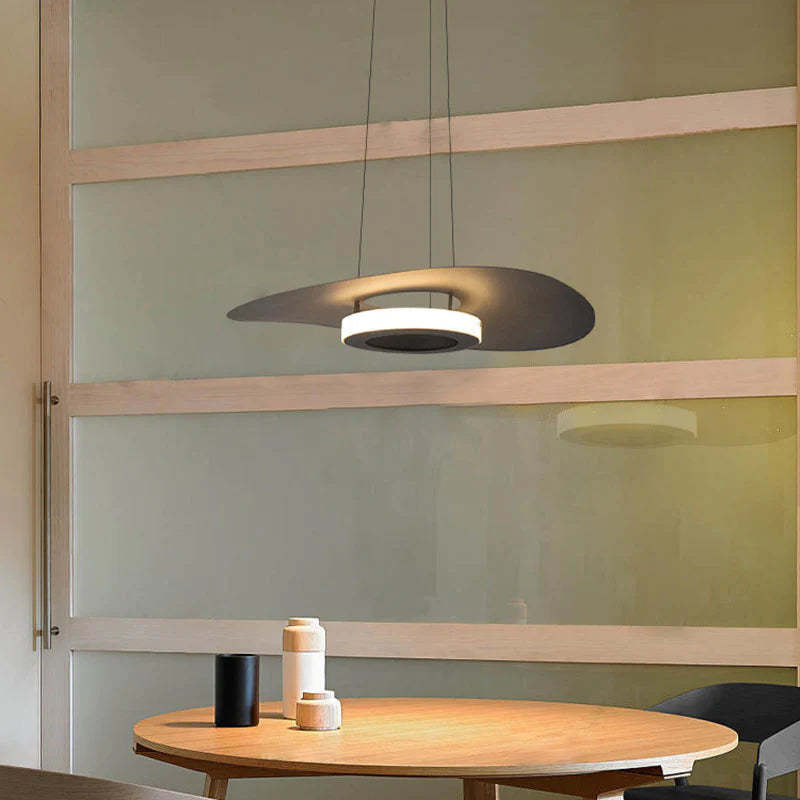 Modern Carins LED pendant light over dining table