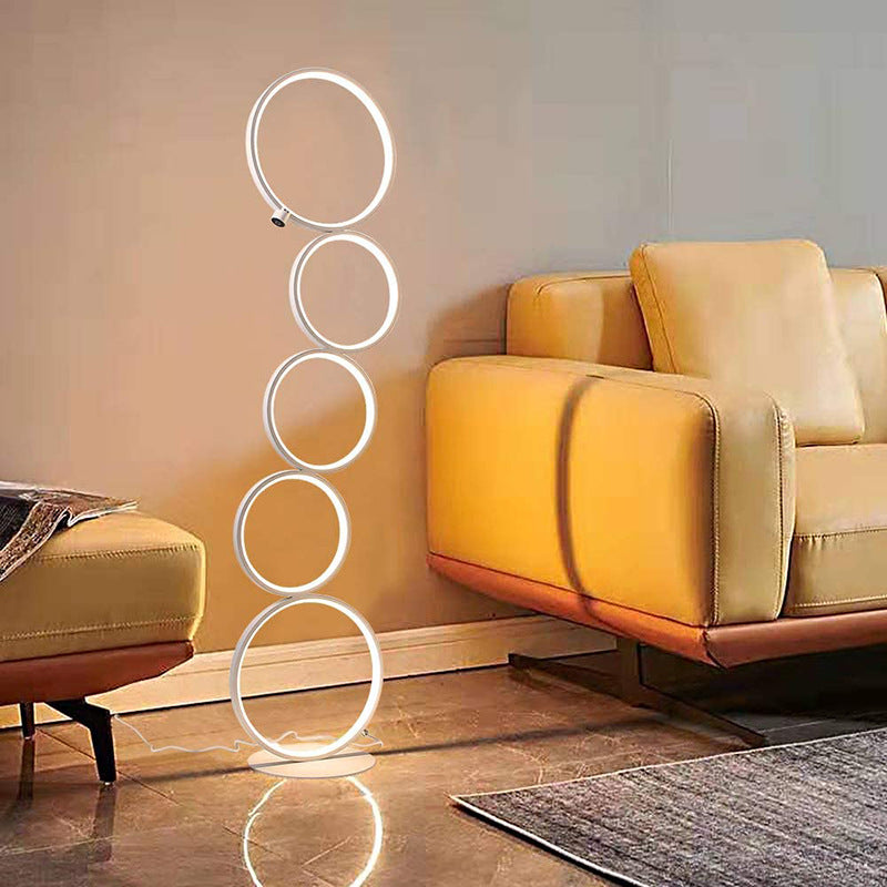 Modern ring floor lamp in living room. Arisha lighting solution.