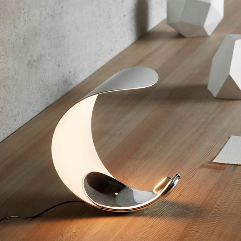 Modern moon shaped LED table lamp on wood