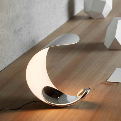 Modern moon shaped LED table lamp on wood