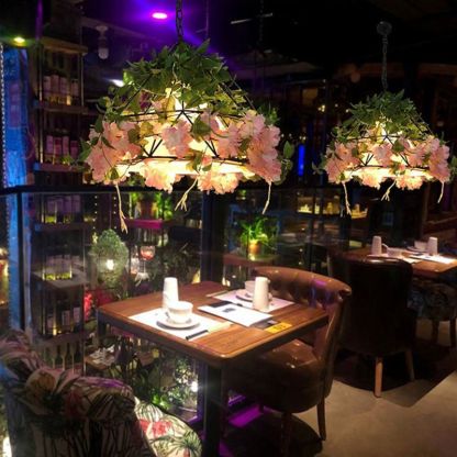 Nest Natural Decorative Flower Metal Pendant Light in a restaurant