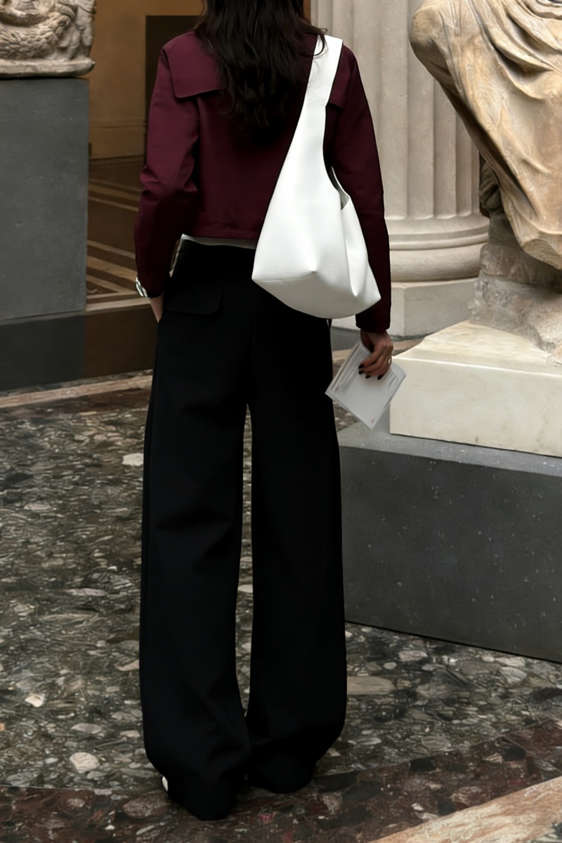 Loose-fitting straight-leg trousers with a three-dimensional pleated, draped waistband.