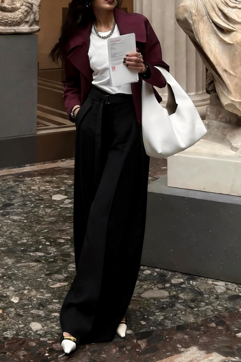 Loose-fitting straight-leg trousers with a three-dimensional pleated, draped waistband.