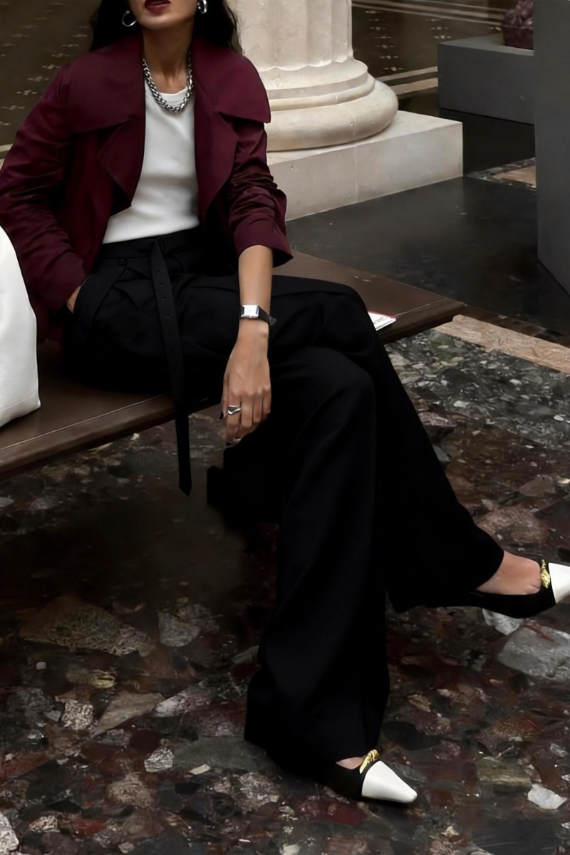 Loose-fitting straight-leg trousers with a three-dimensional pleated, draped waistband.