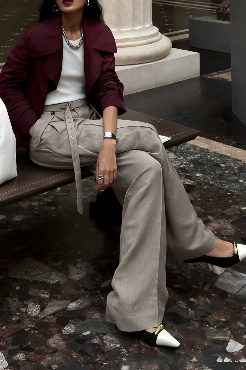 Loose-fitting straight-leg trousers with a three-dimensional pleated, draped waistband.
