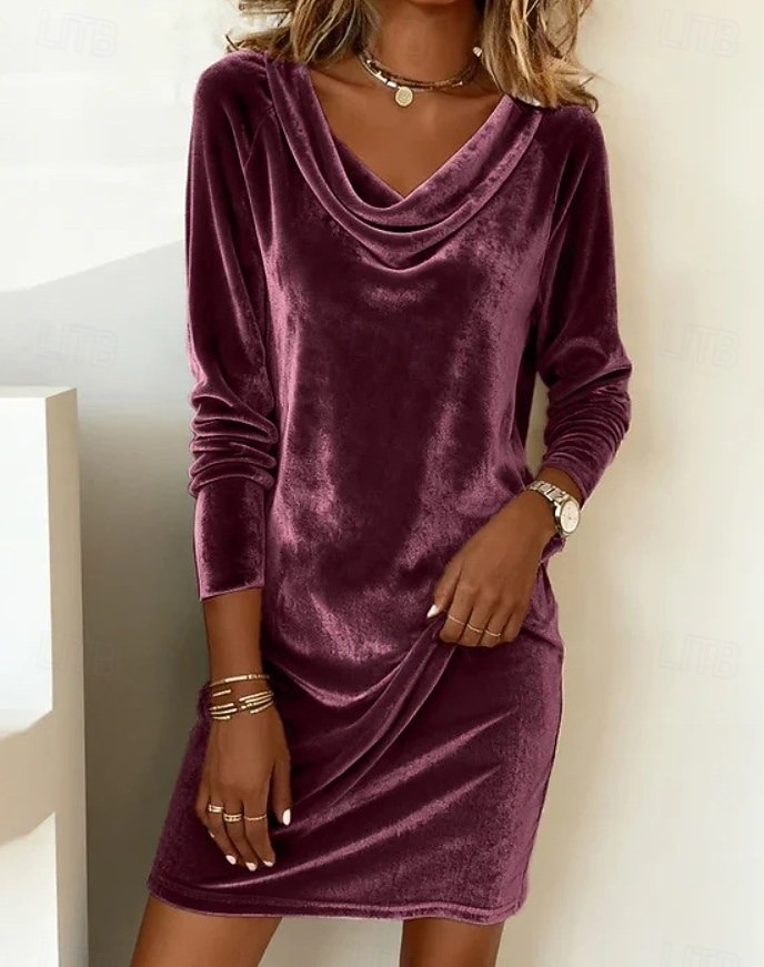 This women's velvet dress with a cowl neck exudes elegance and sophistication.