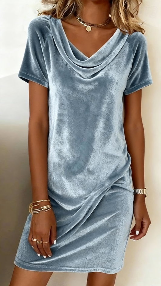 This women's velvet dress with a cowl neck exudes elegance and sophistication.