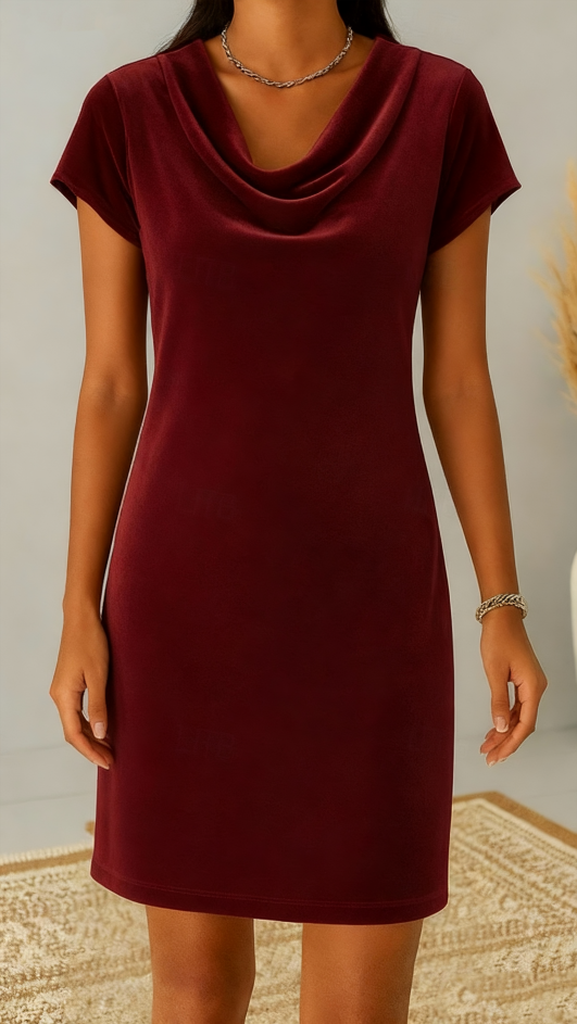 This women's velvet dress with a cowl neck exudes elegance and sophistication.