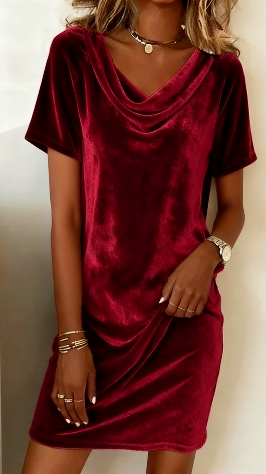 This women's velvet dress with a cowl neck exudes elegance and sophistication.