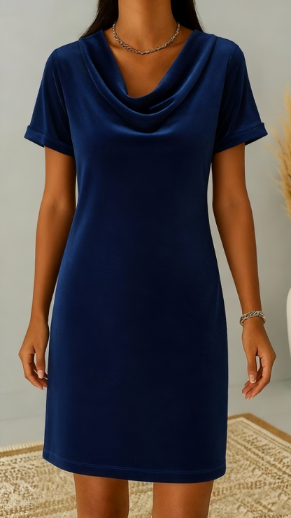This women's velvet dress with a cowl neck exudes elegance and sophistication.