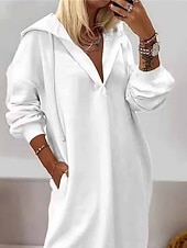 Women's long-sleeved pullover hoodie dress with solid color and side slits.