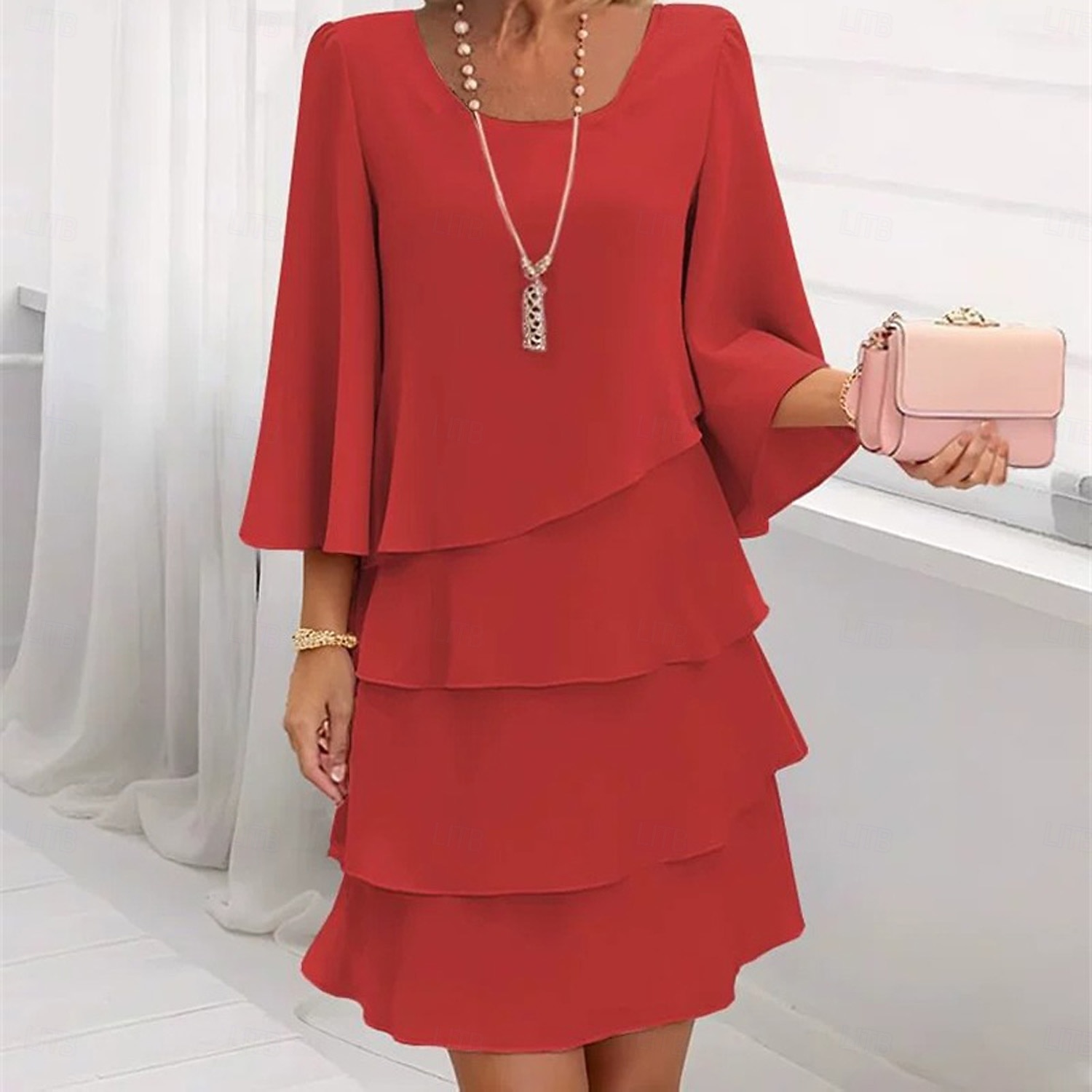 Women's round-neck tiered cake dress, elegant, loose-fitting, and flattering round-neck dress.