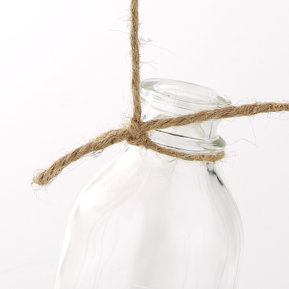 86076	 L6.5"W3"H8.5" - GLASS BOTTLE WITH A SWING BASE