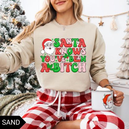 Santa Knows You’ve Been A B*tch – Humorous Christmas Graphic Shirt