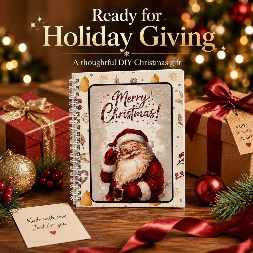 A spiral-bound DIY Christmas gift book with a 'Merry Christmas' Santa illustration, styled on a wooden table with wrapped presents, ornaments, ribbons, and holiday lights in the background. Text at the top reads 'Ready for Holiday Giving'.