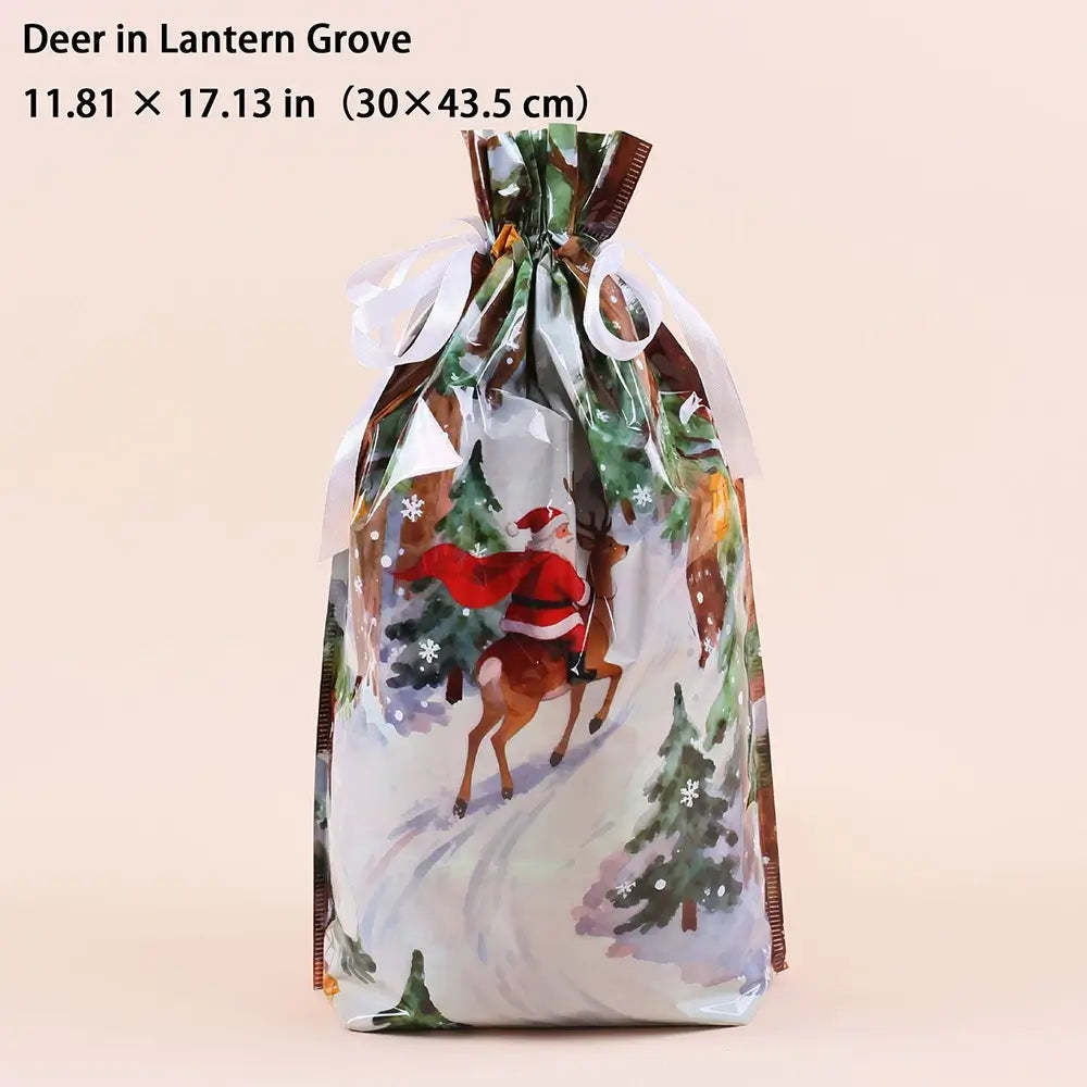A festive drawstring gift bag with a printed winter scene featuring Santa Claus on a deer, evergreen trees, and snowy ground. The bag is shown against a solid pale peach background with text at the top reading 'Deer in Lantern Grove