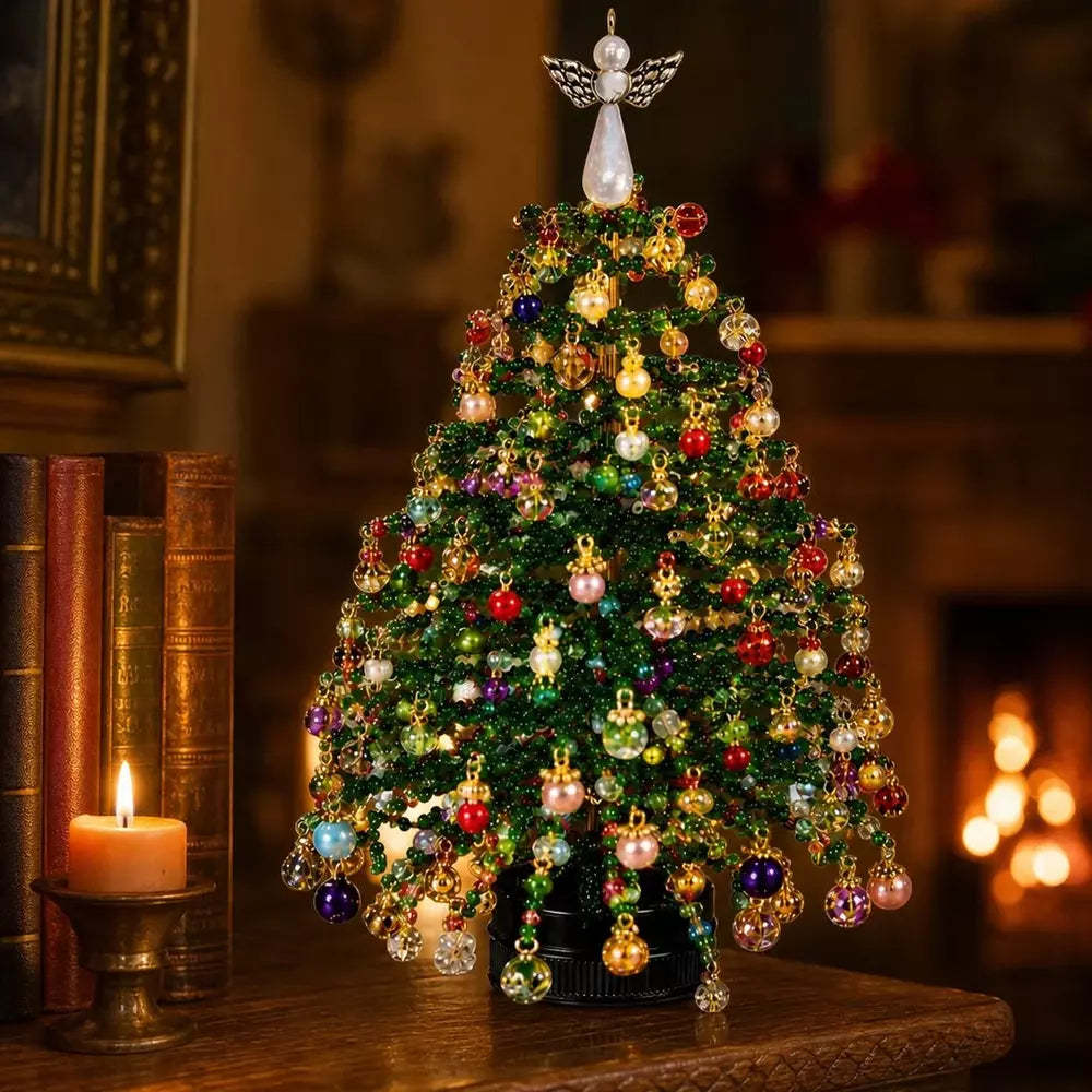 Finished beaded Christmas tree displayed as a festive tabletop decoration