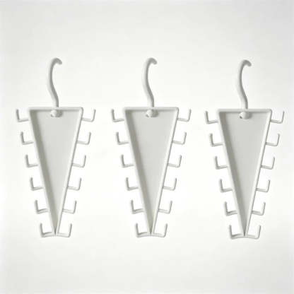 Three white triangular wall hooks with multiple small side hooks, shown on a plain light background.