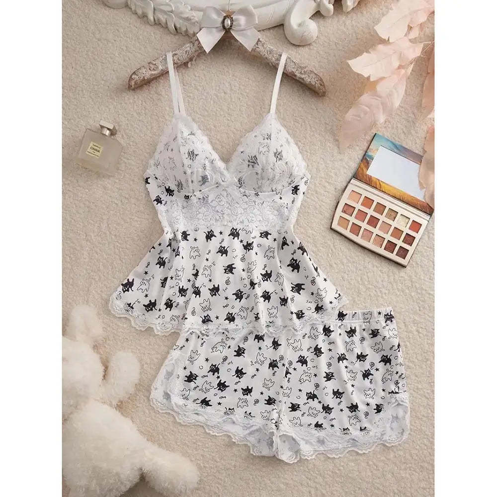 White women's Halloween pajama set with black cat and spooky character print