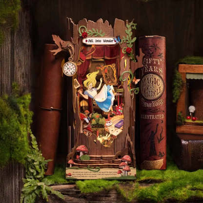 Alice in Wonderland book nook kit with LED lights turned on, glowing warmly inside the miniature scene.