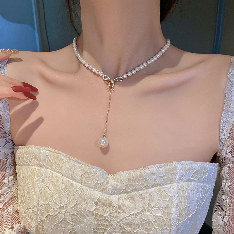Elegant Pearl Necklace with Zirconia Bow