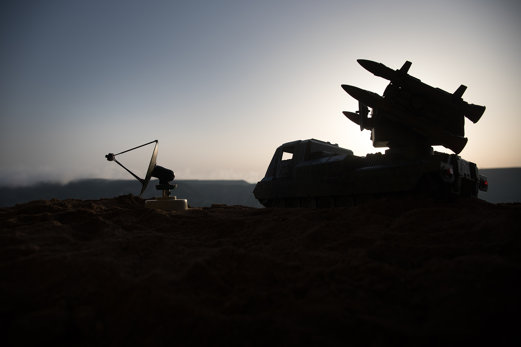 How does a laser target designator work?