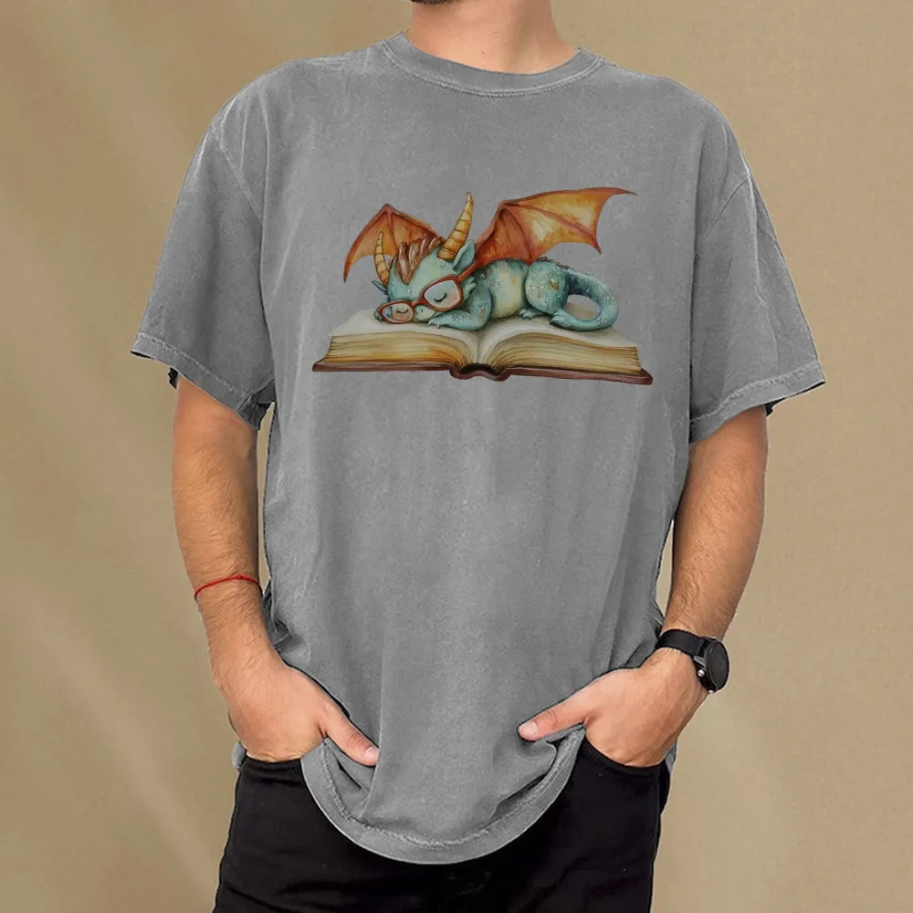 Pagewings Cute Green Dragon Sleeping Peacefully On A Large Open Book Unisex Washed T-shirt