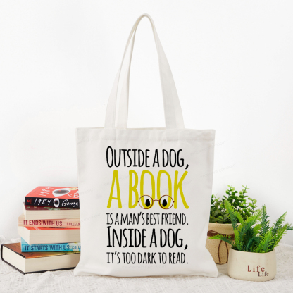 Pagewings Outside a dog a book is a mans best friend Funny Tote Bag
