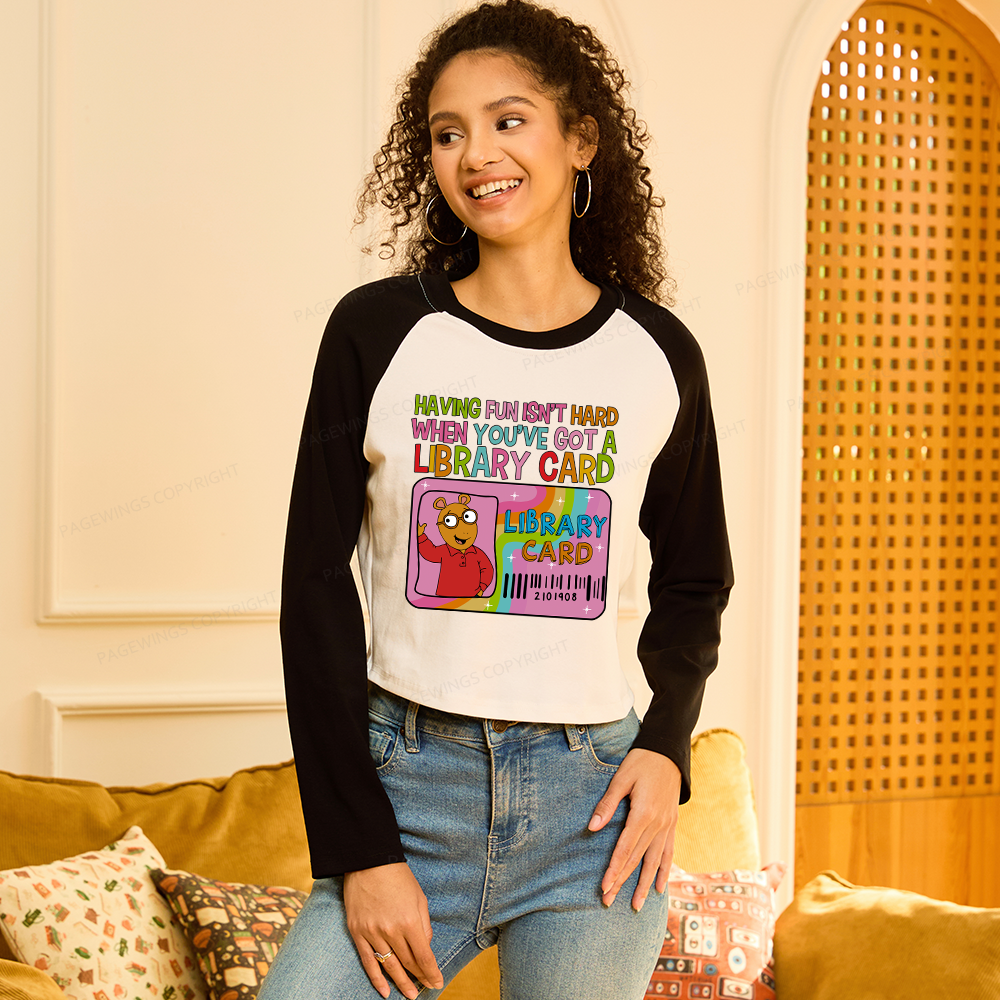 Pagewings Got A Library Card Women Long Sleeve Crop Raglan T-shirt