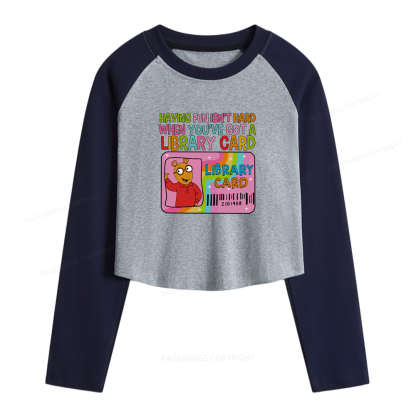 Pagewings Got A Library Card Women Long Sleeve Crop Raglan T-shirt