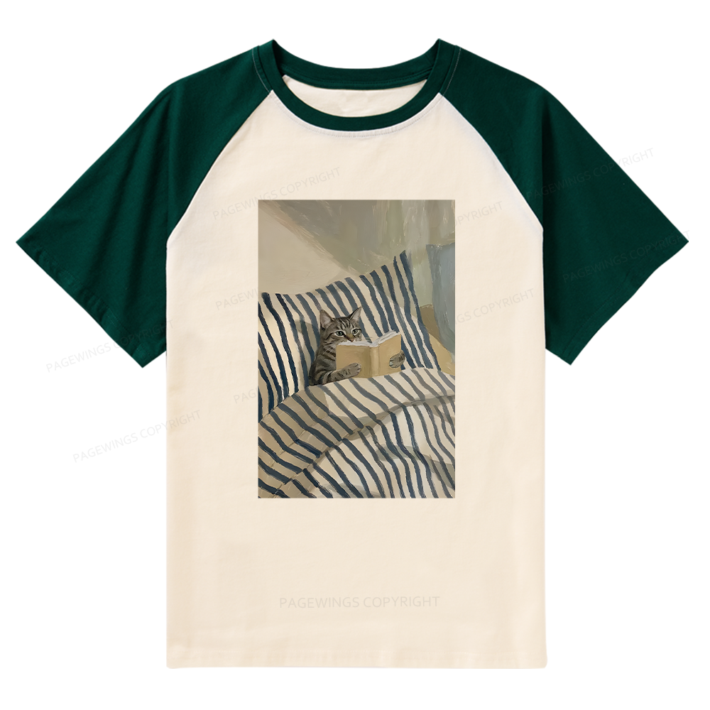 Pagewings Cat Reading Book In Bed Raglan T-shirt