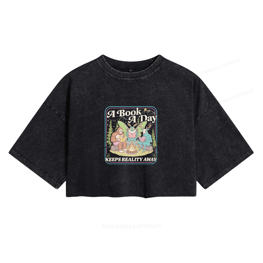 Pagewings A Book A Day Keeps Reality Away Women's Washed Cropped T-shirt