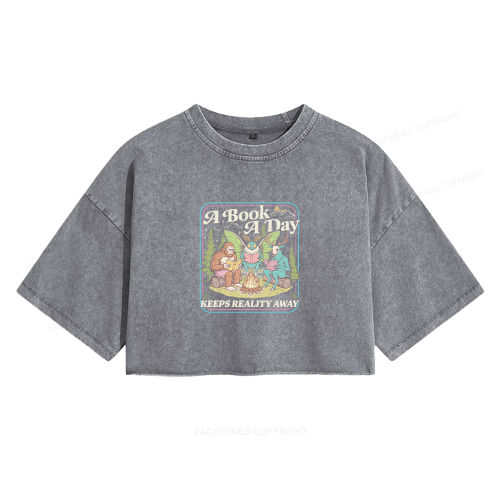 Pagewings A Book A Day Keeps Reality Away Women's Washed Cropped T-shirt