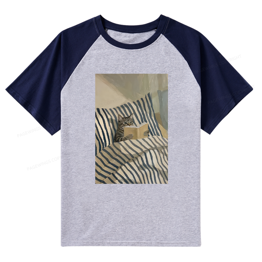 Pagewings Cat Reading Book In Bed Raglan T-shirt
