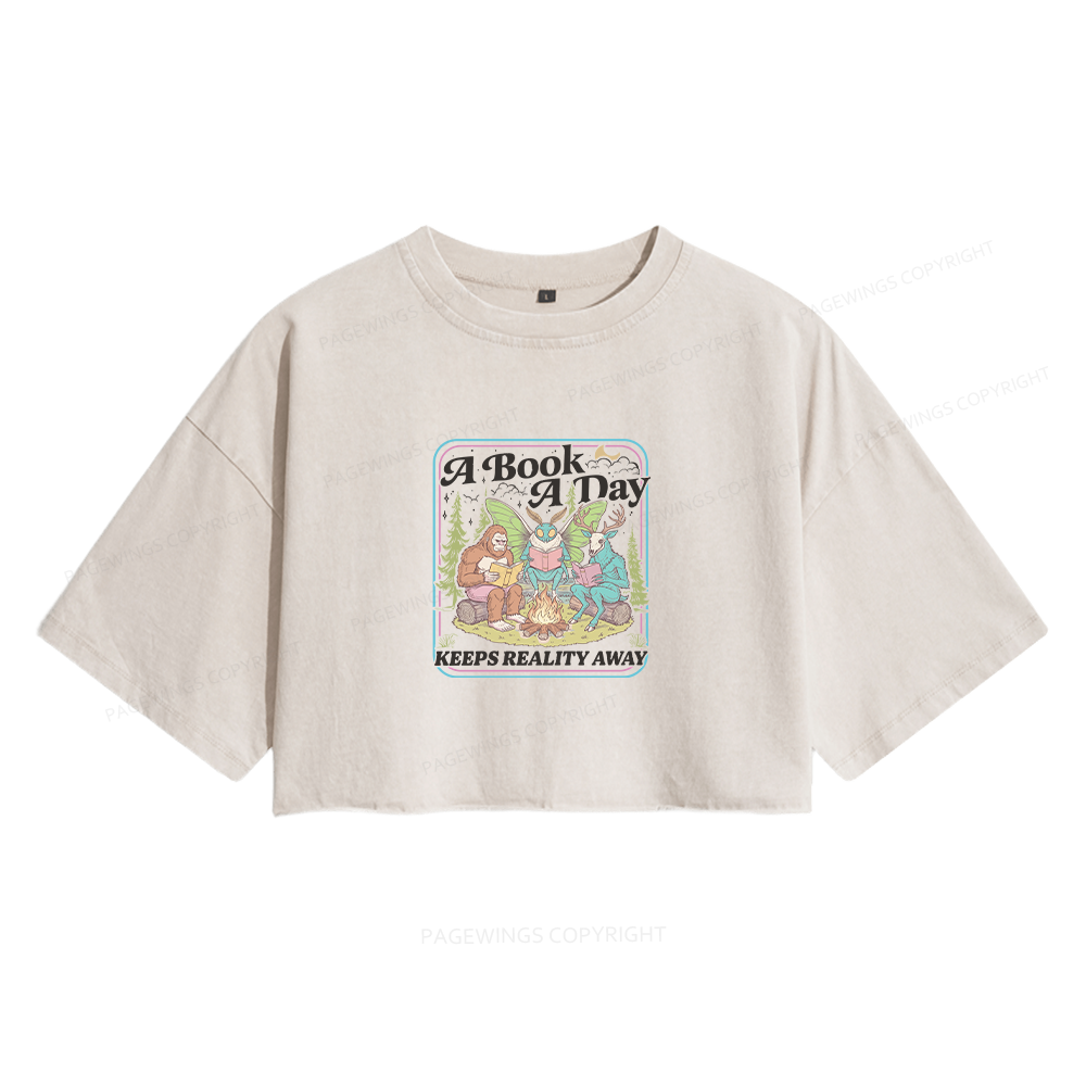 Pagewings A Book A Day Keeps Reality Away Women's Washed Cropped T-shirt