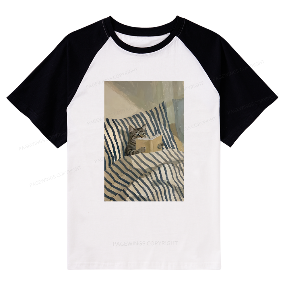 Pagewings Cat Reading Book In Bed Raglan T-shirt