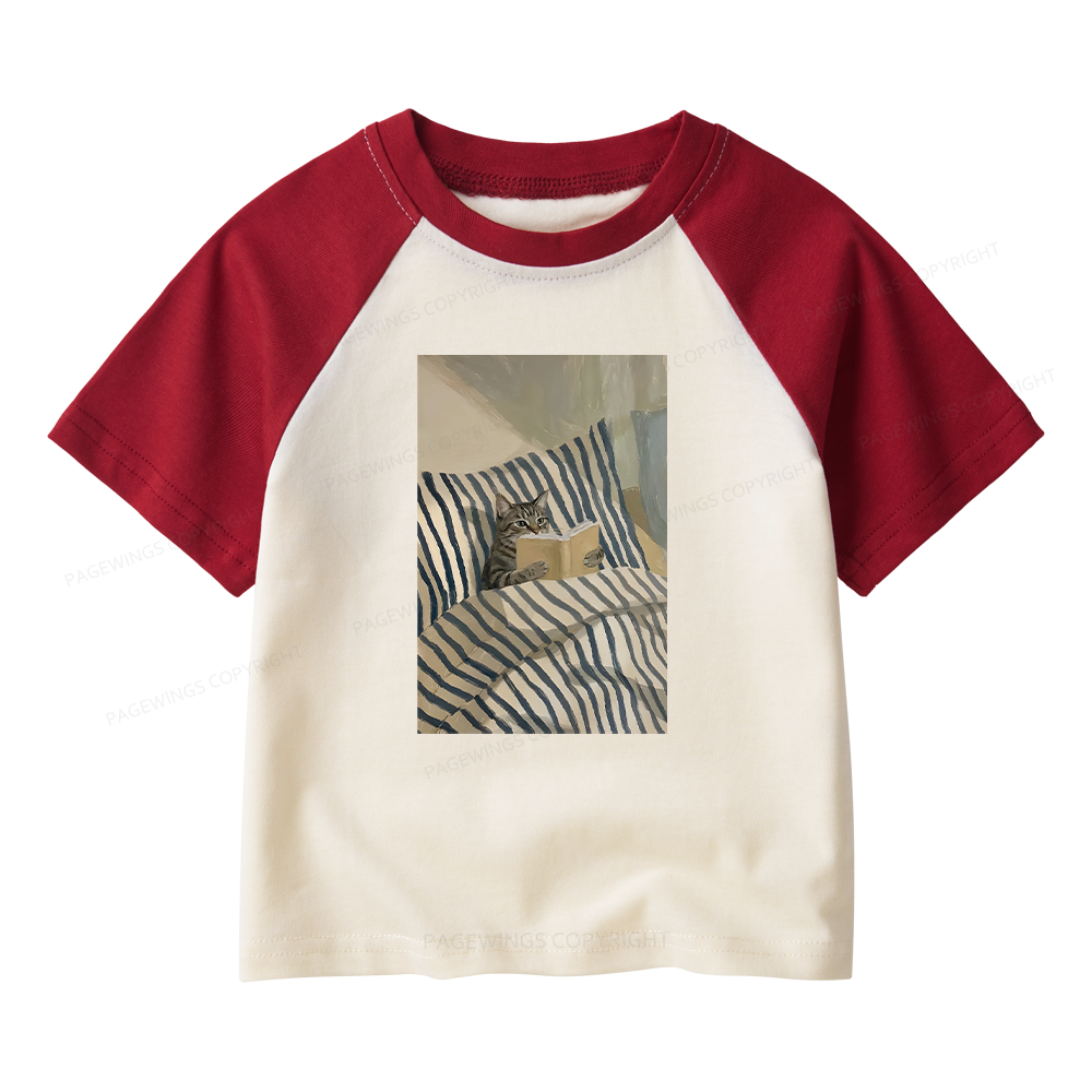 Pagewings Cat Reading Book In Bed Kids Raglan T-shirt 