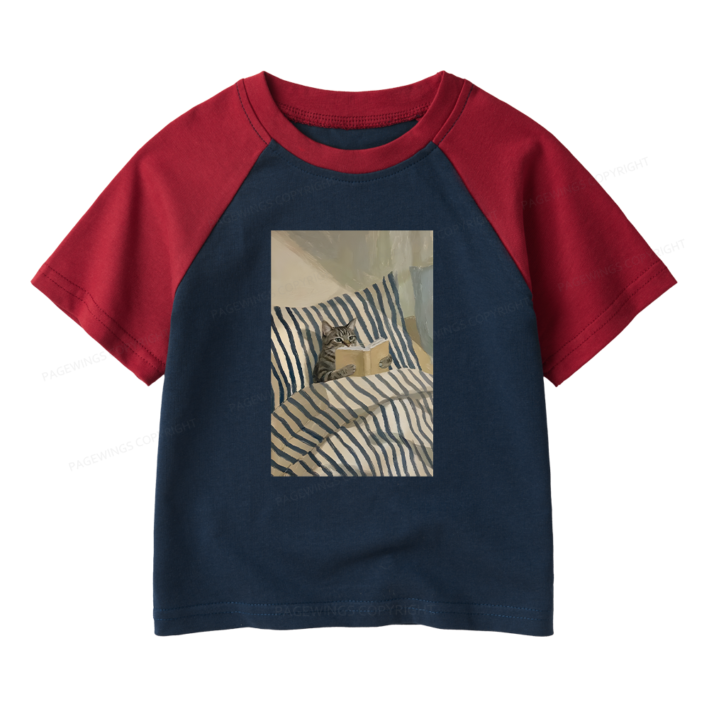 Pagewings Cat Reading Book In Bed Kids Raglan T-shirt 