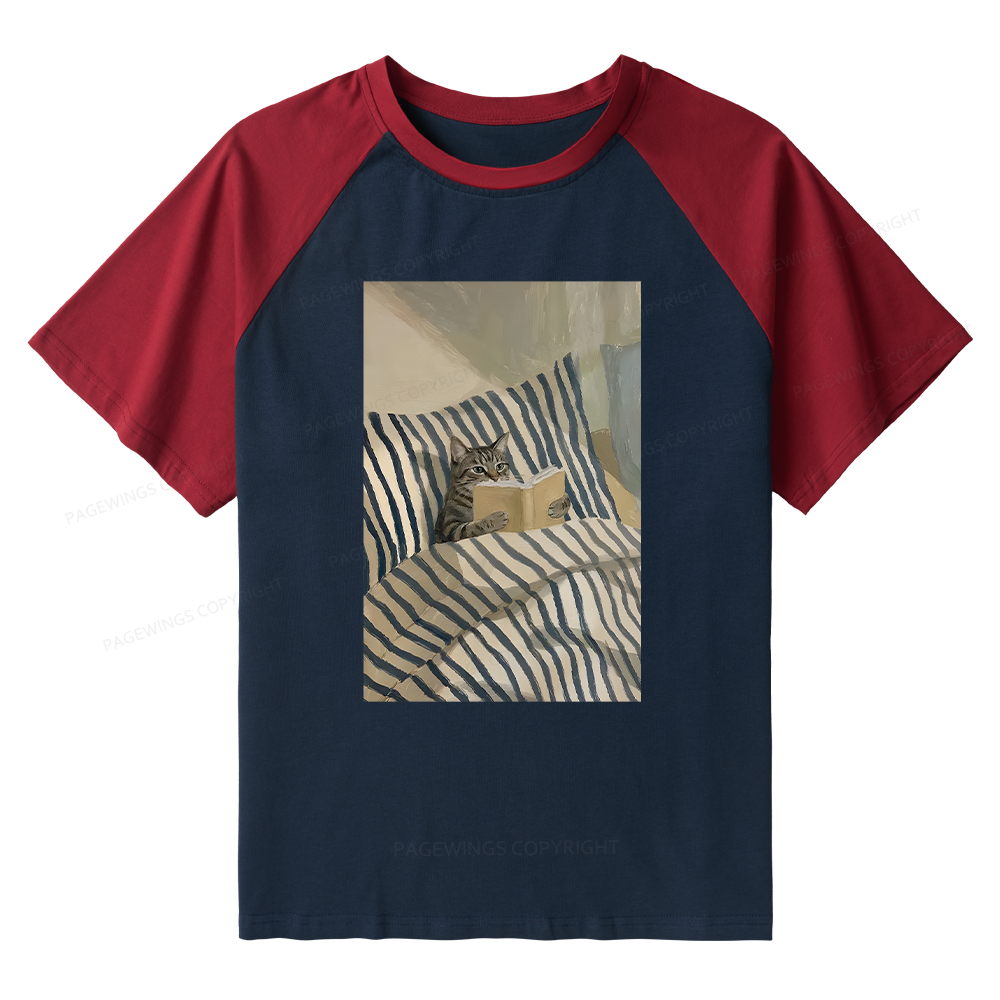 Pagewings Cat Reading Book In Bed Raglan T-shirt