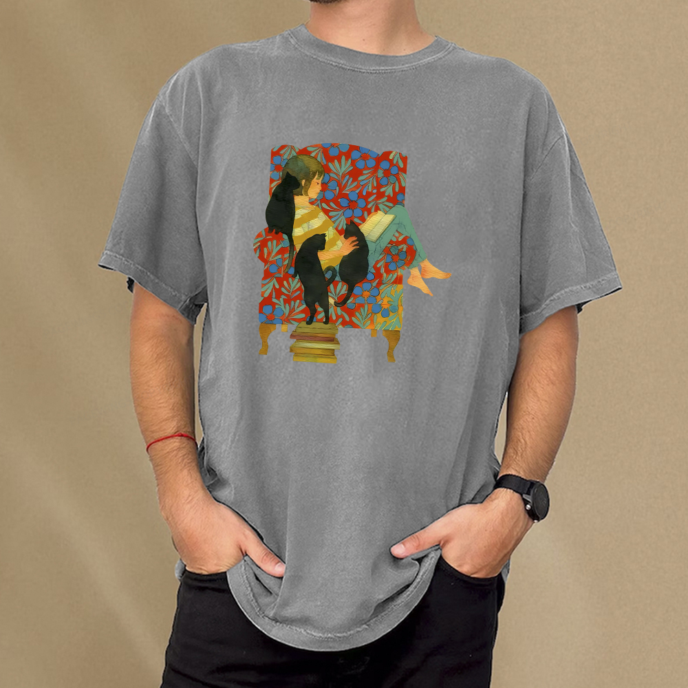 Pagewing A girl reading a book on the sofa Unisex Washed T-shirt