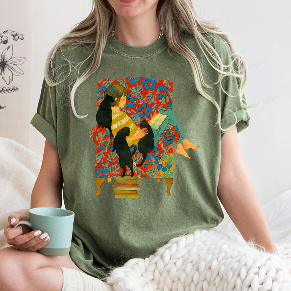 Pagewing A girl reading a book on the sofa Unisex Washed T-shirt