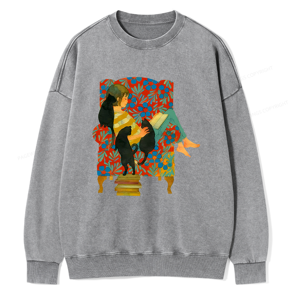 Pagewin A girl reading a book on the sofa Unisex Washed Sweatshirt