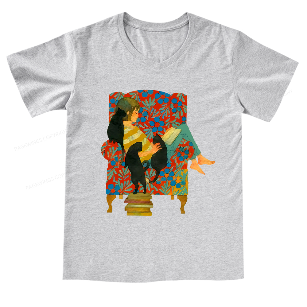 Pagewings A girl reading a book on the sofa V-neck T-shirt