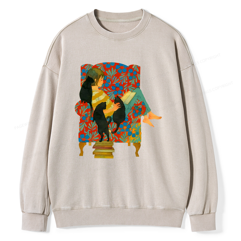 Pagewin A girl reading a book on the sofa Unisex Washed Sweatshirt
