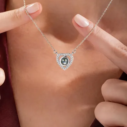 A Woman Wearing Custom Cubic Zirconia Heart Photo Projection Necklace