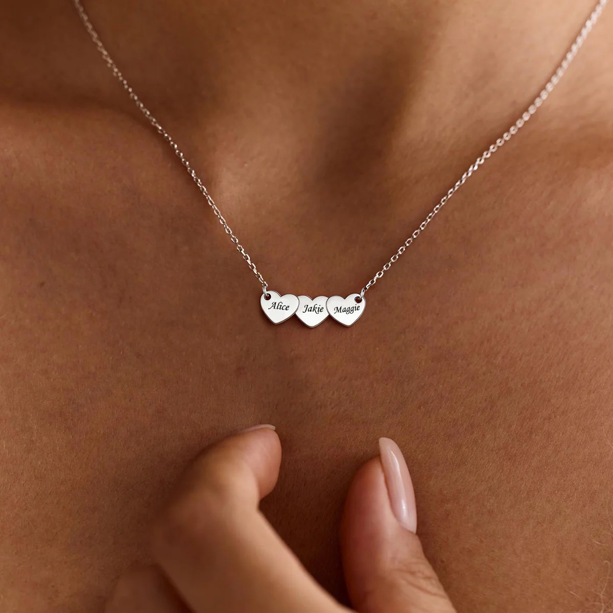 A Woman Wearing Custom Engraved 3 Hearts Name Necklace