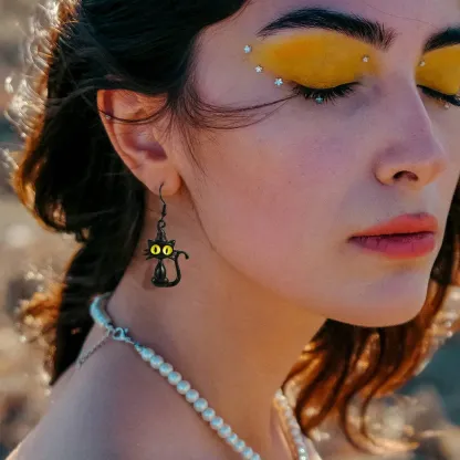 A Woman Wearing Halloween Black Cat Drop Earrings